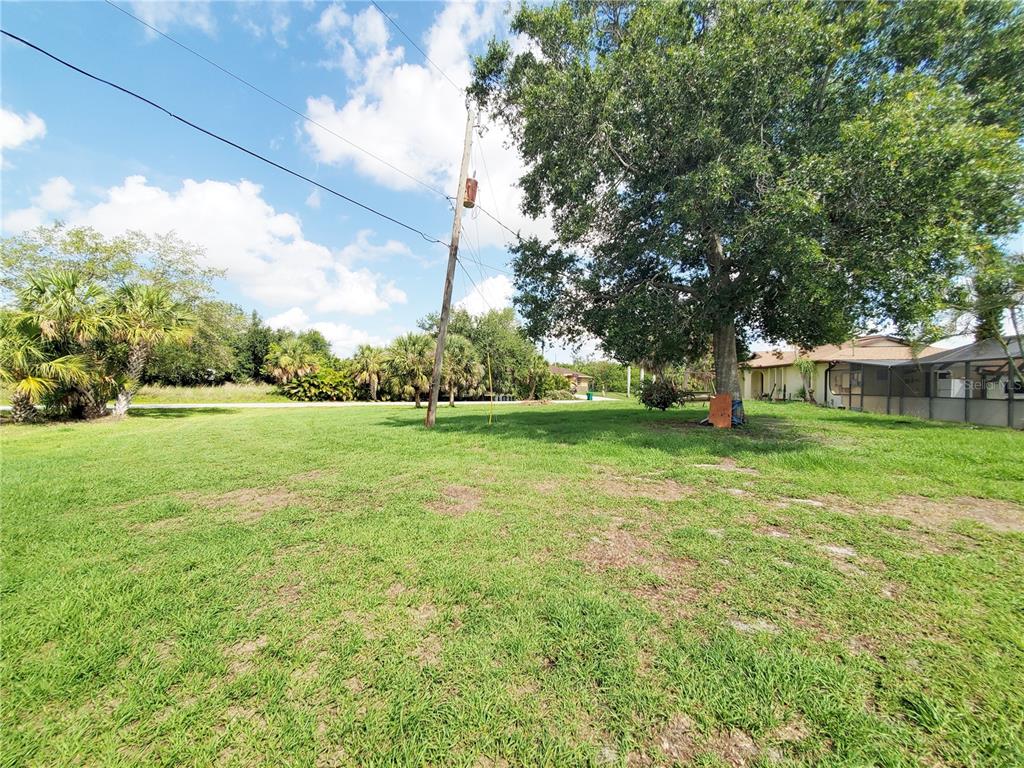 3456 Highlands Road Punta Gorda, FL 33983 - Photo 69 of 80 a view of a field with a tree