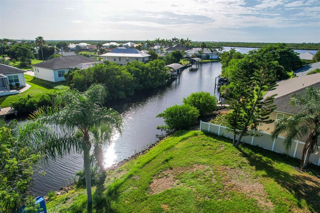 3456 Highlands Road Punta Gorda, FL 33983 - Photo 75 of 80 an aerial view of residential houses with outdoor space and lake view