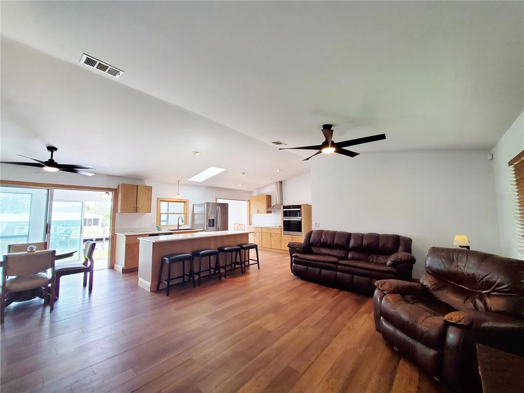 3456 Highlands Road Punta Gorda, FL 33983 - Photo 9 of 80 a living room with furniture and wooden floor