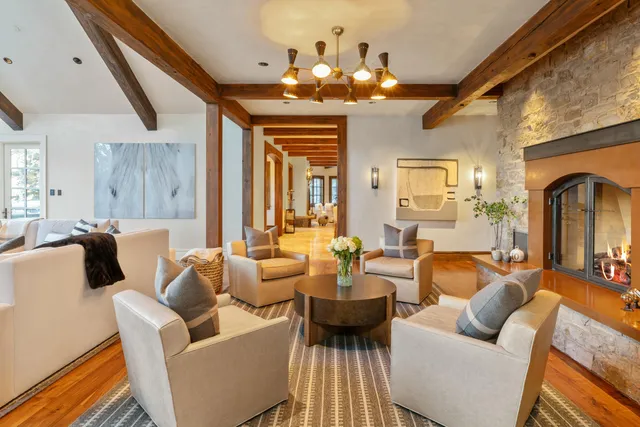 a kitchen with a stove a table and chairs