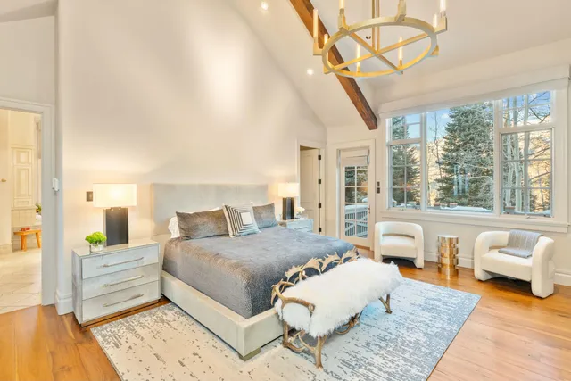 a view of a living room and chandelier