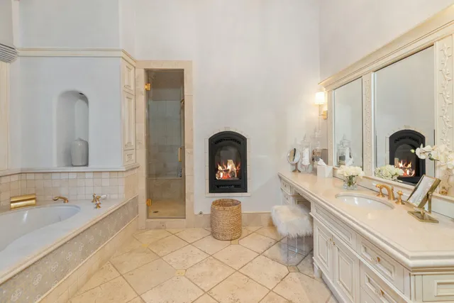 a living room with furniture ceiling fan and a large window
