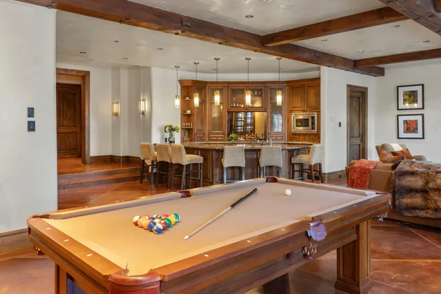 a bedroom with a bed and a mirror