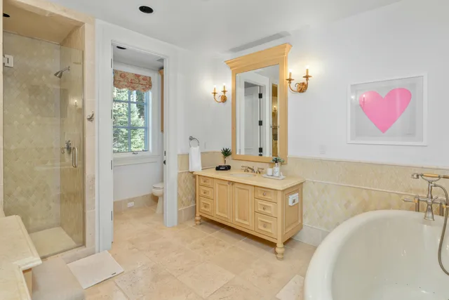 a bathroom with a granite countertop sink vanity and a mirror