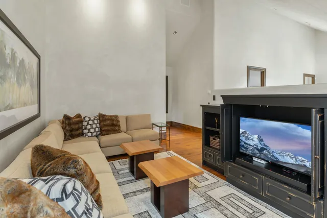 a view of a lush green forest with lots of trees