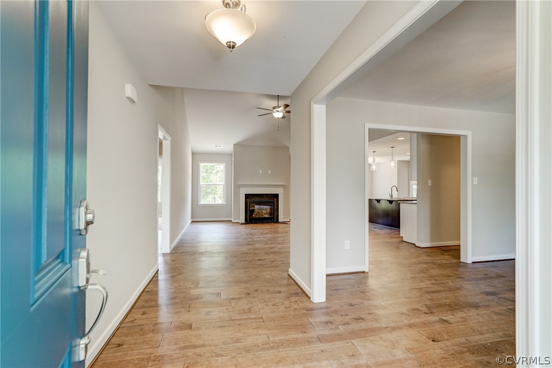 7113 Appleman Road Chesterfield, VA 23832 - Photo 3 of 22 a view of a livingroom with wooden floor and a kitchen space