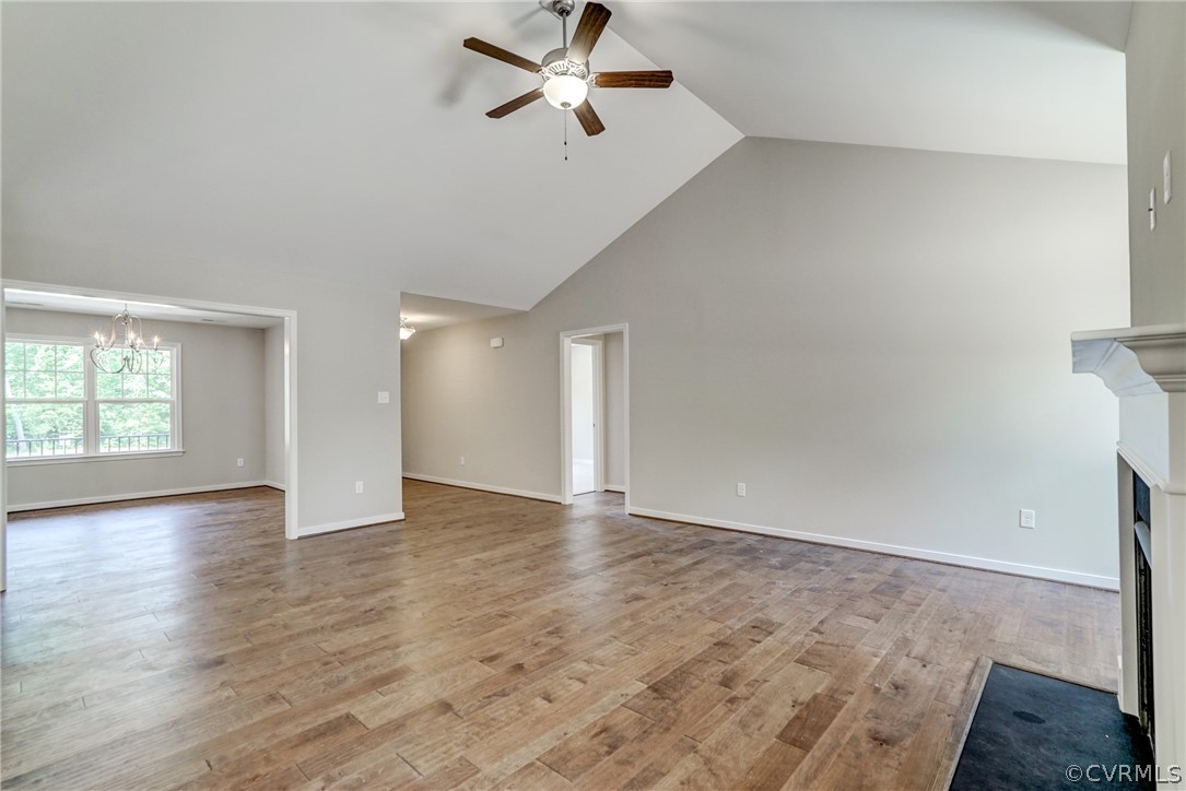 7113 Appleman Road Chesterfield, VA 23832 - Photo 4 of 22 an empty room with wooden floor fan and windows