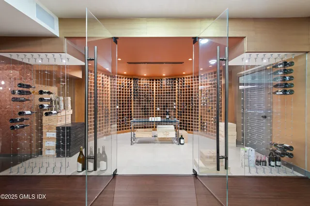 a green field with trees in the background