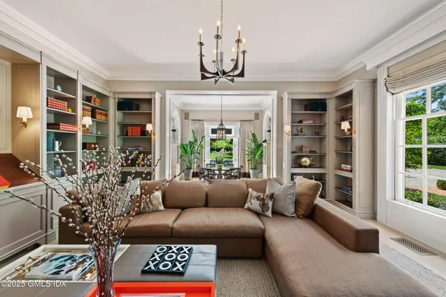 a view of a livingroom with furniture and window