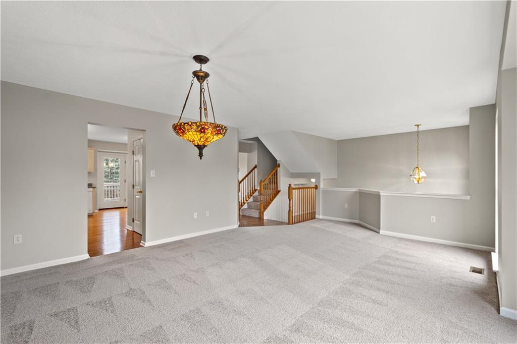 81501 Lost Valley Drive Mars, PA 16046 - Photo 11 of 25 a view of a kitchen with a sink cabinet and a chandelier
