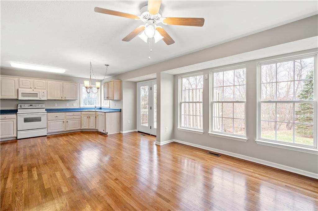81501 Lost Valley Drive Mars, PA 16046 - Photo 16 of 25 a view of an empty room with window and wooden floor