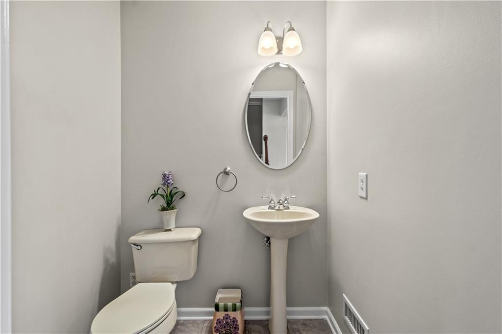 81501 Lost Valley Drive Mars, PA 16046 - Photo 18 of 25 a bathroom with a toilet sink and mirror