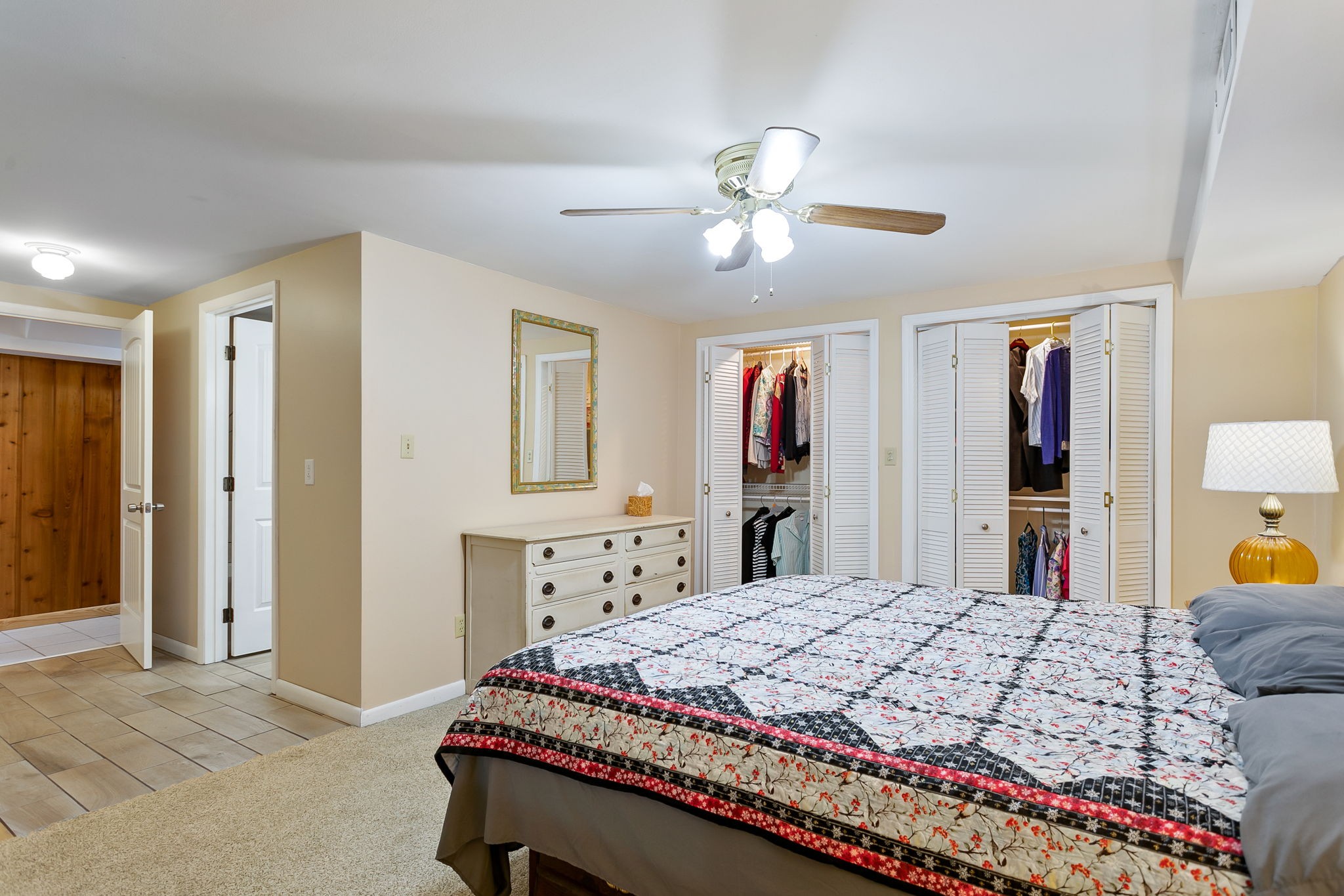 2811 Ernest Hawkins Road Columbia, TN 38401 - Photo 29 of 58 a bedroom with a bed and a chandelier