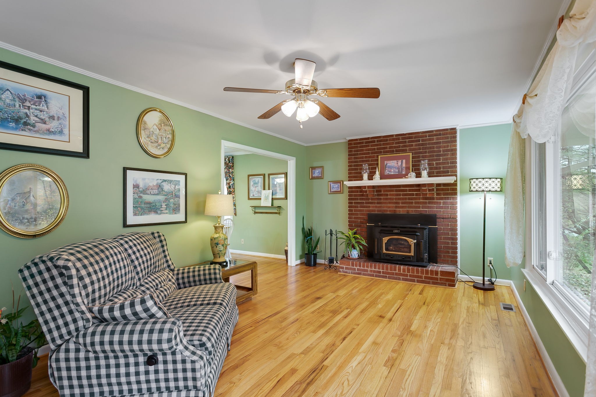 2811 Ernest Hawkins Road Columbia, TN 38401 - Photo 7 of 58 a living room with furniture a clock and a fireplace