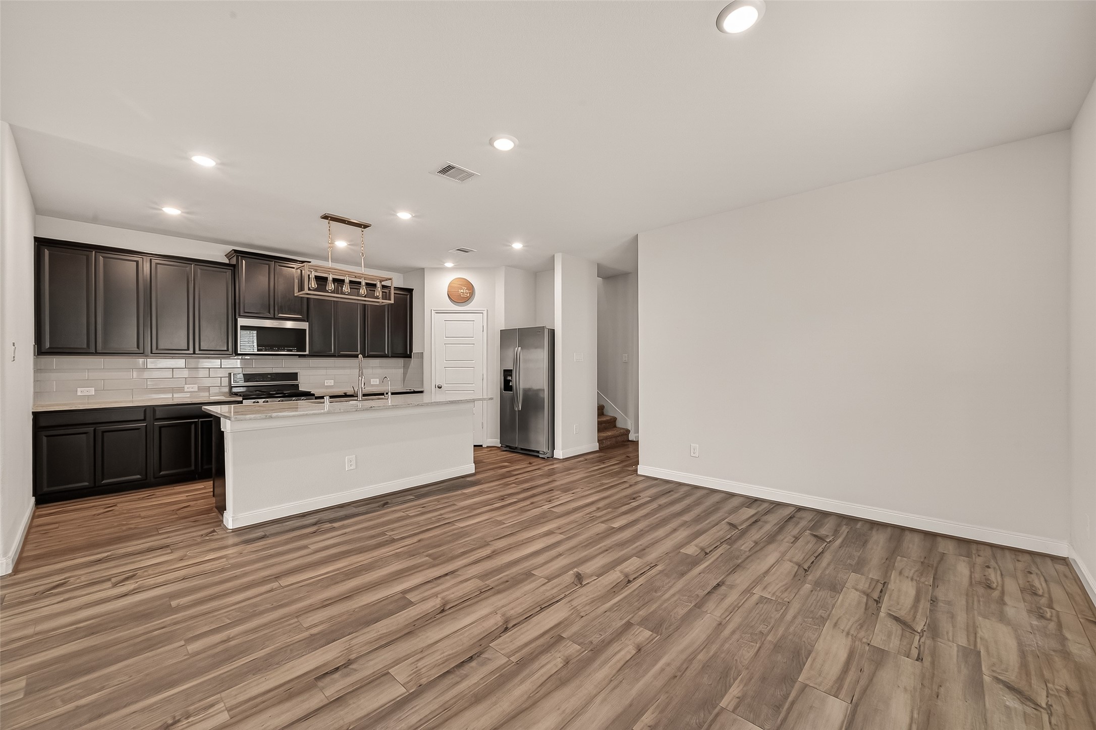 4231 Reese Ravine Lane Katy, TX 77493 - Photo 5 of 32 The vinyl flooring is easy to care for!