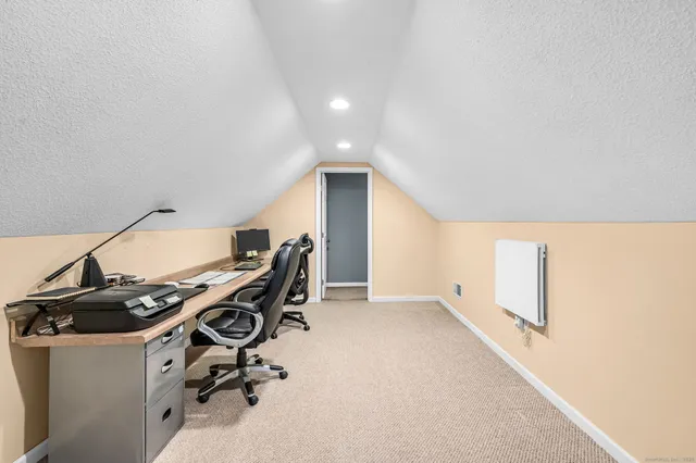 a view of a workspace with furniture