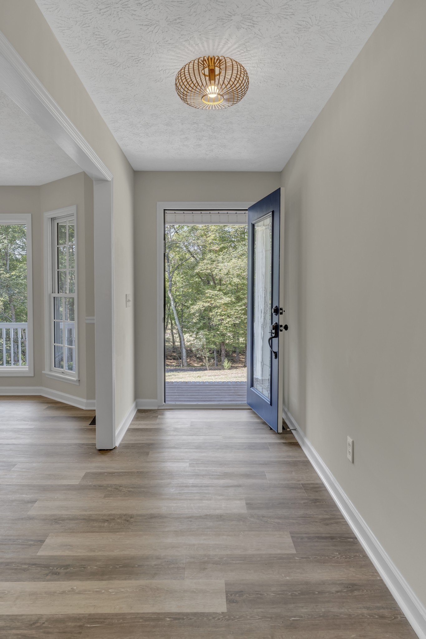 6041 Henry Gower Road Pleasant View, TN 37146 - Photo 13 of 63 a view of an empty room with wooden floor and a window