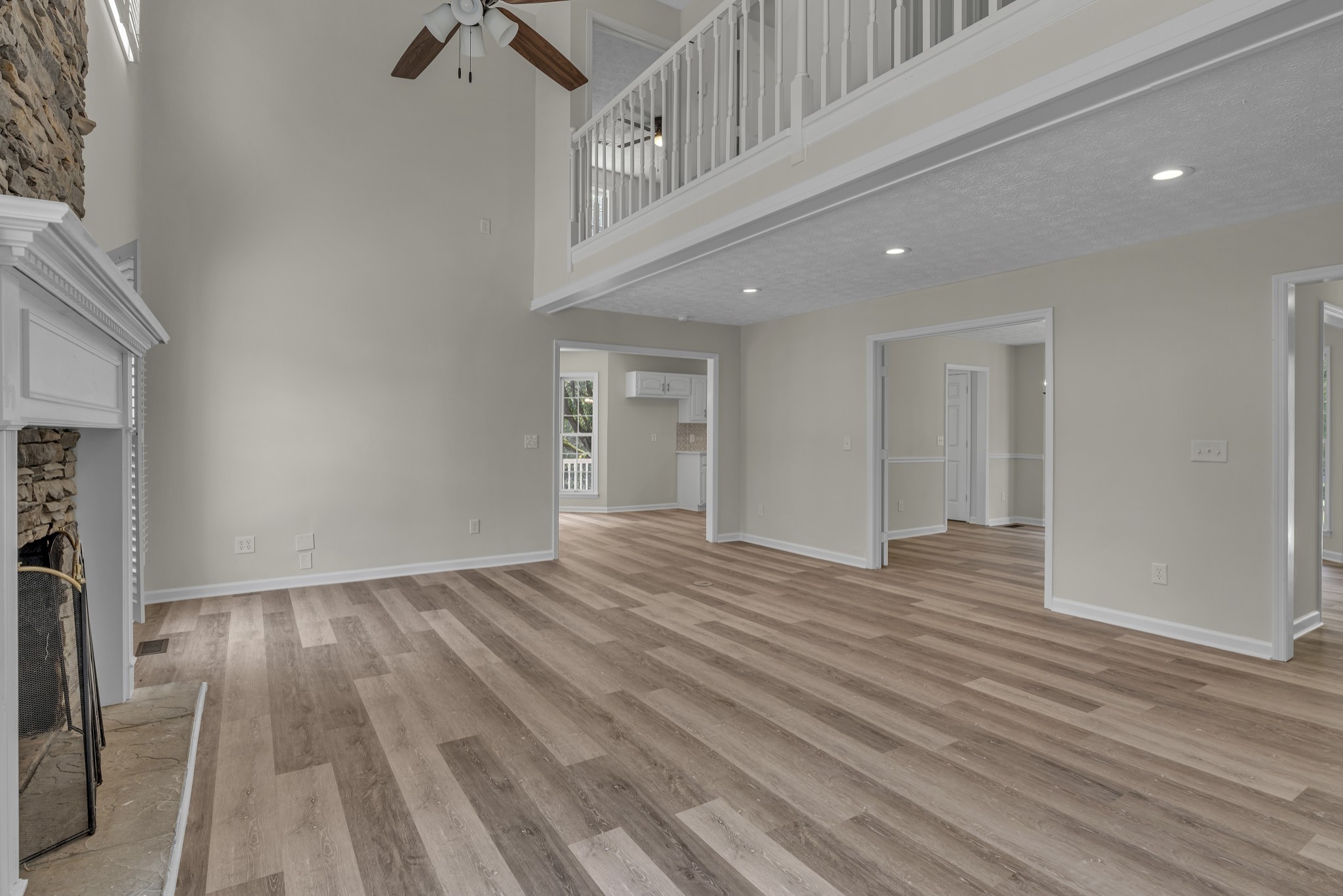 6041 Henry Gower Road Pleasant View, TN 37146 - Photo 16 of 63 a view of an empty room with wooden floor and a window