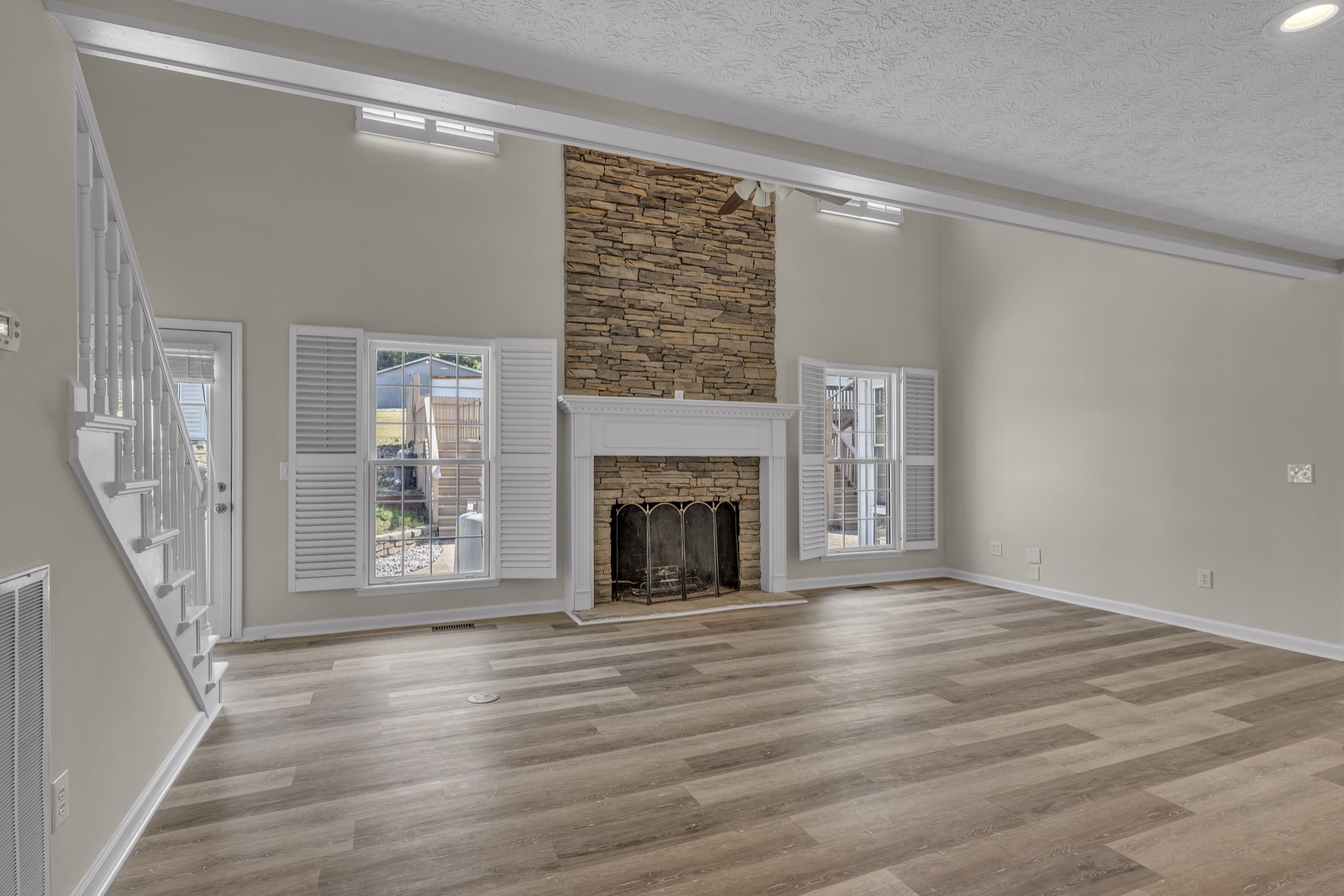 6041 Henry Gower Road Pleasant View, TN 37146 - Photo 17 of 63 a view of an empty room with wooden floor and a window