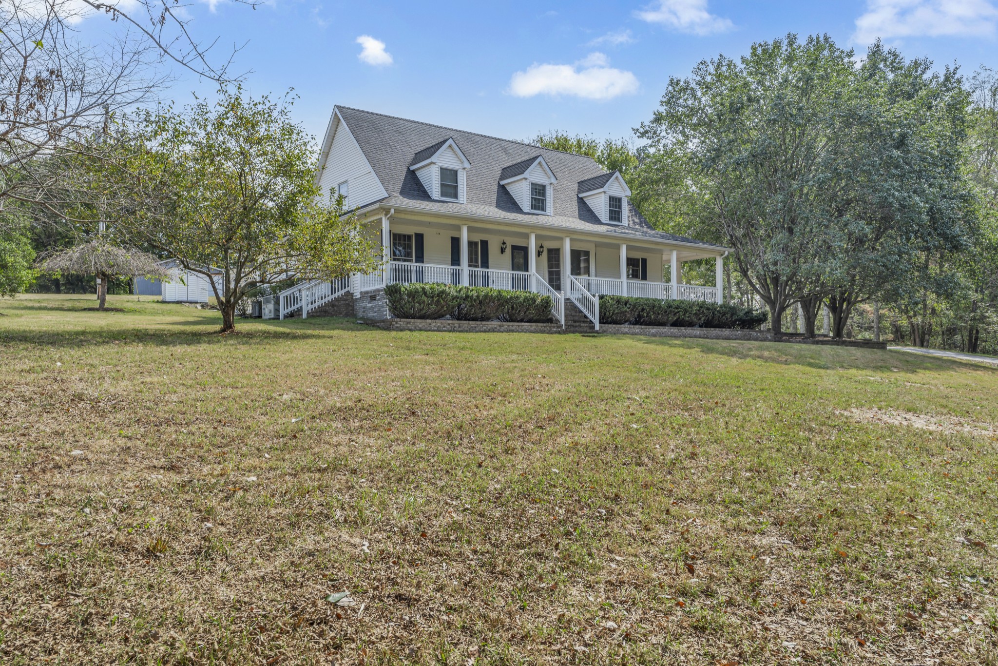 6041 Henry Gower Road Pleasant View, TN 37146 - Photo 2 of 63 a front view of a house with a garden