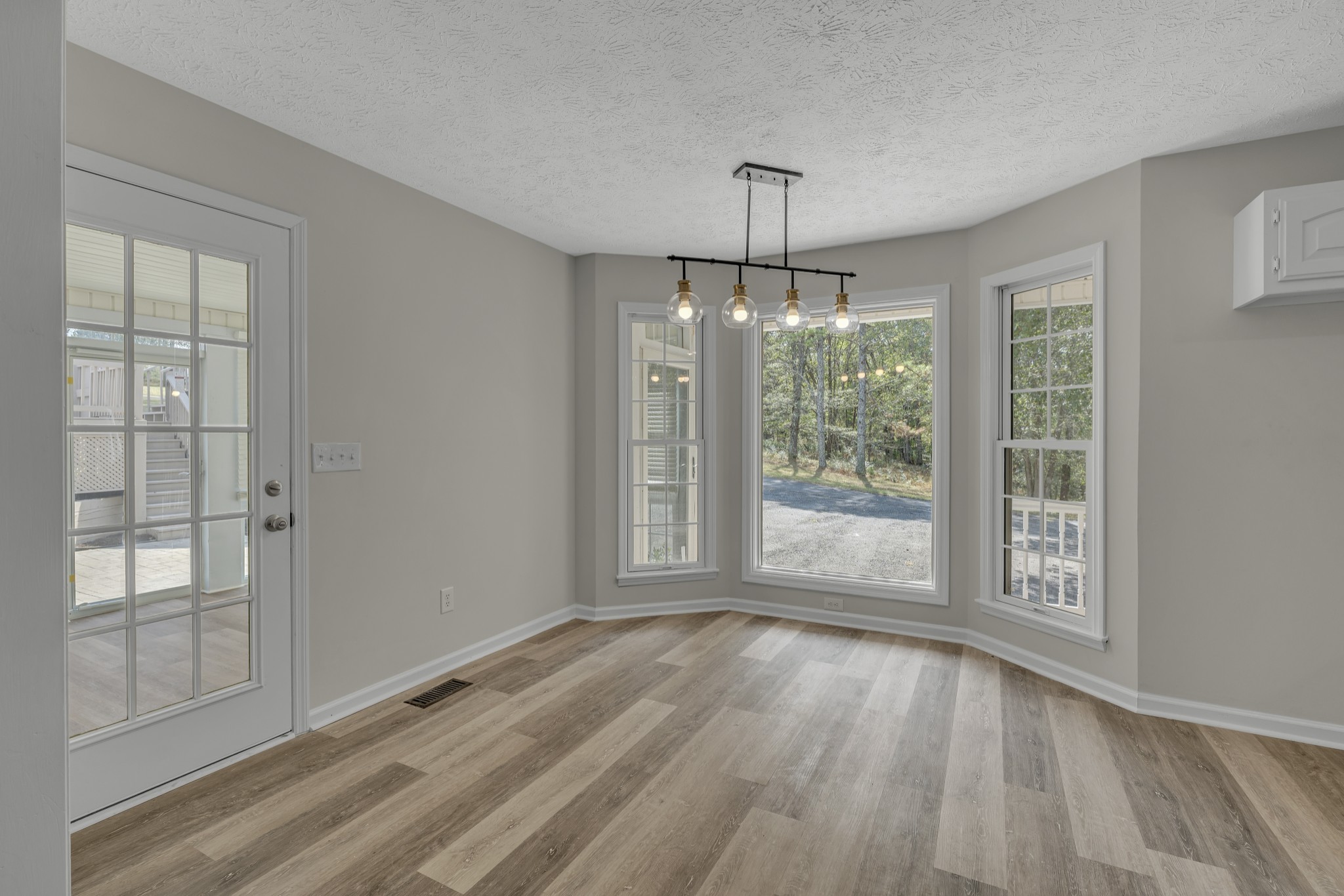 6041 Henry Gower Road Pleasant View, TN 37146 - Photo 21 of 63 wooden floor in an empty room with a window