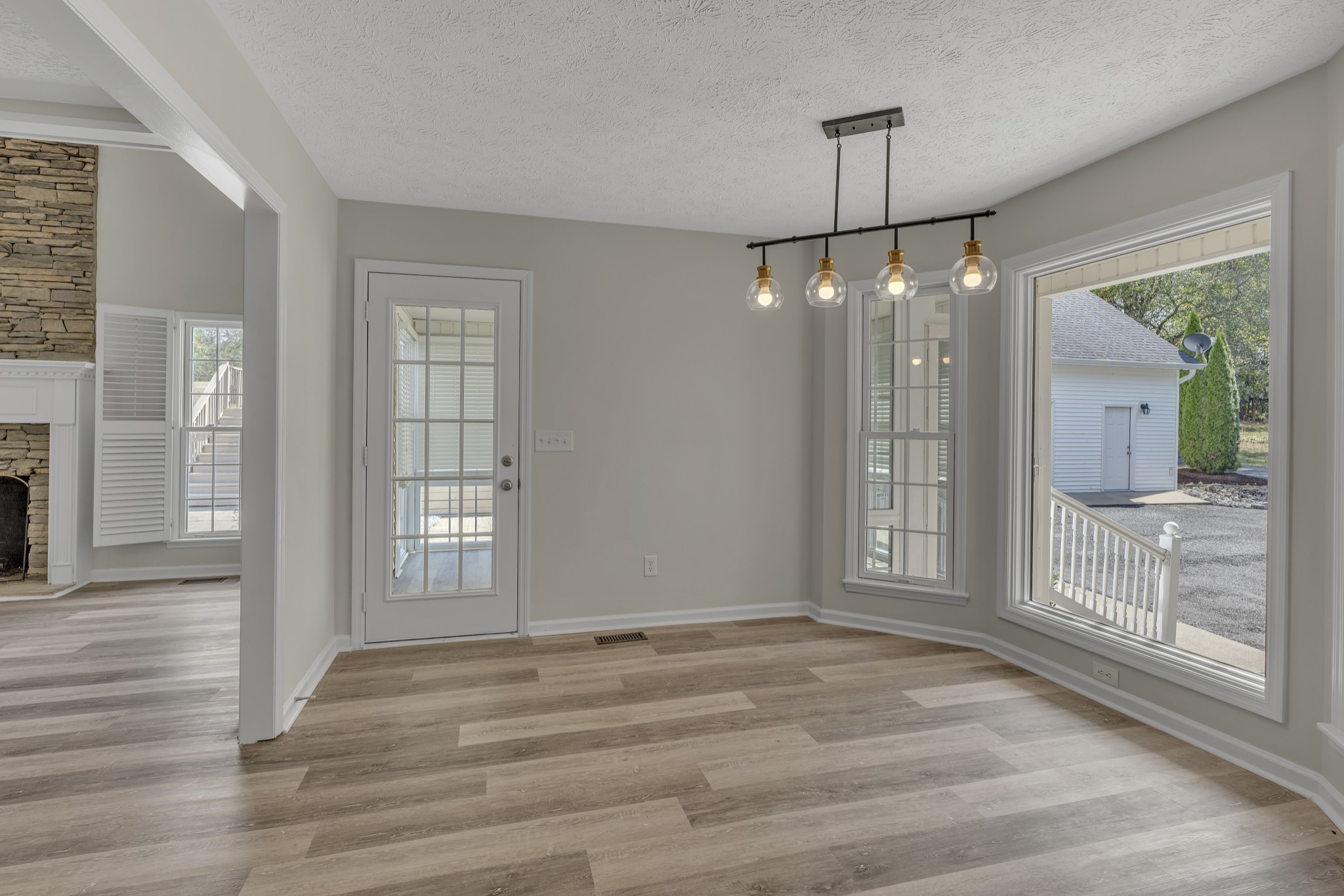 6041 Henry Gower Road Pleasant View, TN 37146 - Photo 22 of 63 a view of an empty room with glass door and a window