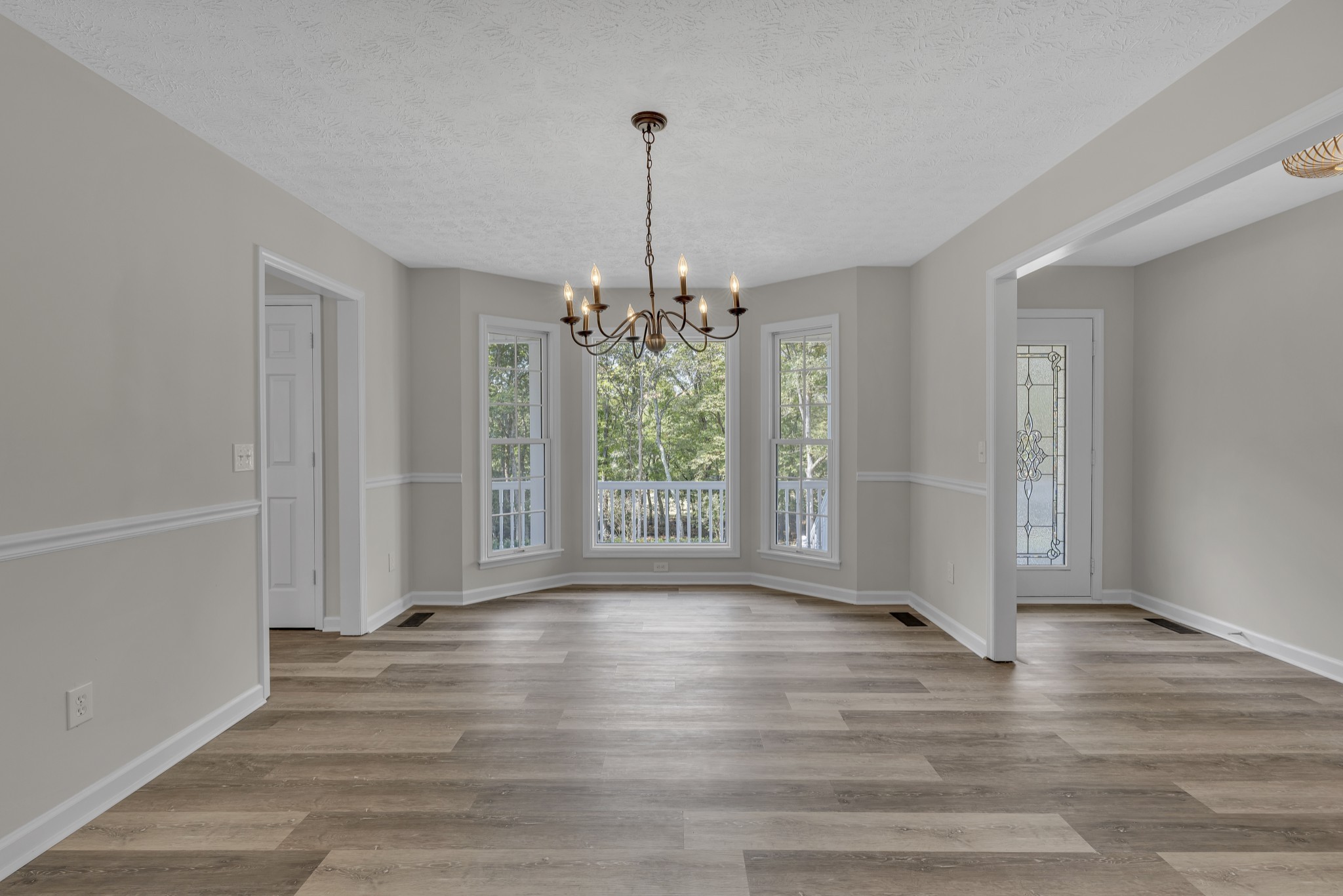6041 Henry Gower Road Pleasant View, TN 37146 - Photo 23 of 63 a view of an empty room with wooden floor and a window