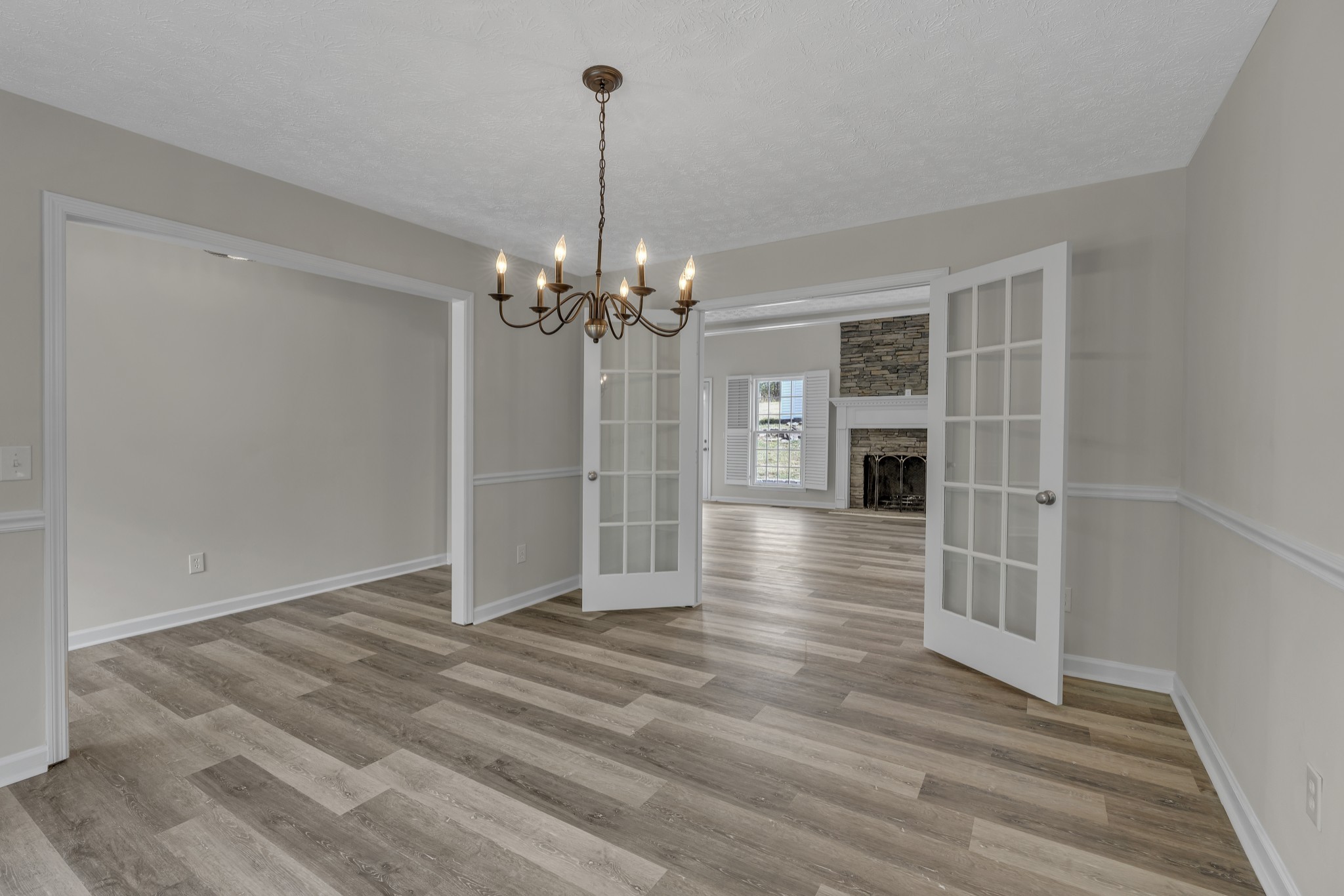 6041 Henry Gower Road Pleasant View, TN 37146 - Photo 24 of 63 a view of a livingroom with wooden floor kitchen and window