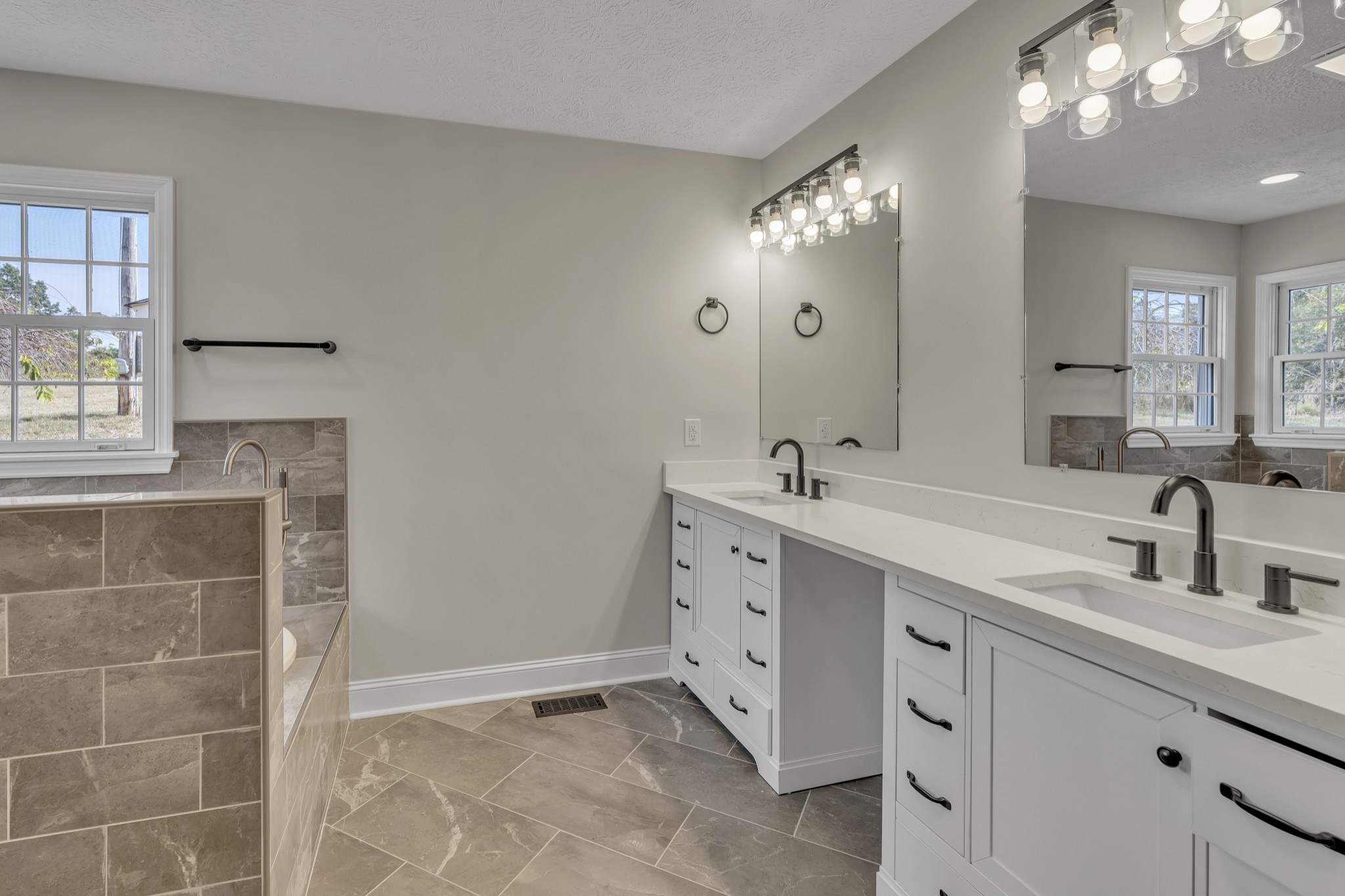 6041 Henry Gower Road Pleasant View, TN 37146 - Photo 25 of 63 a bathroom with a double vanity sink mirror and