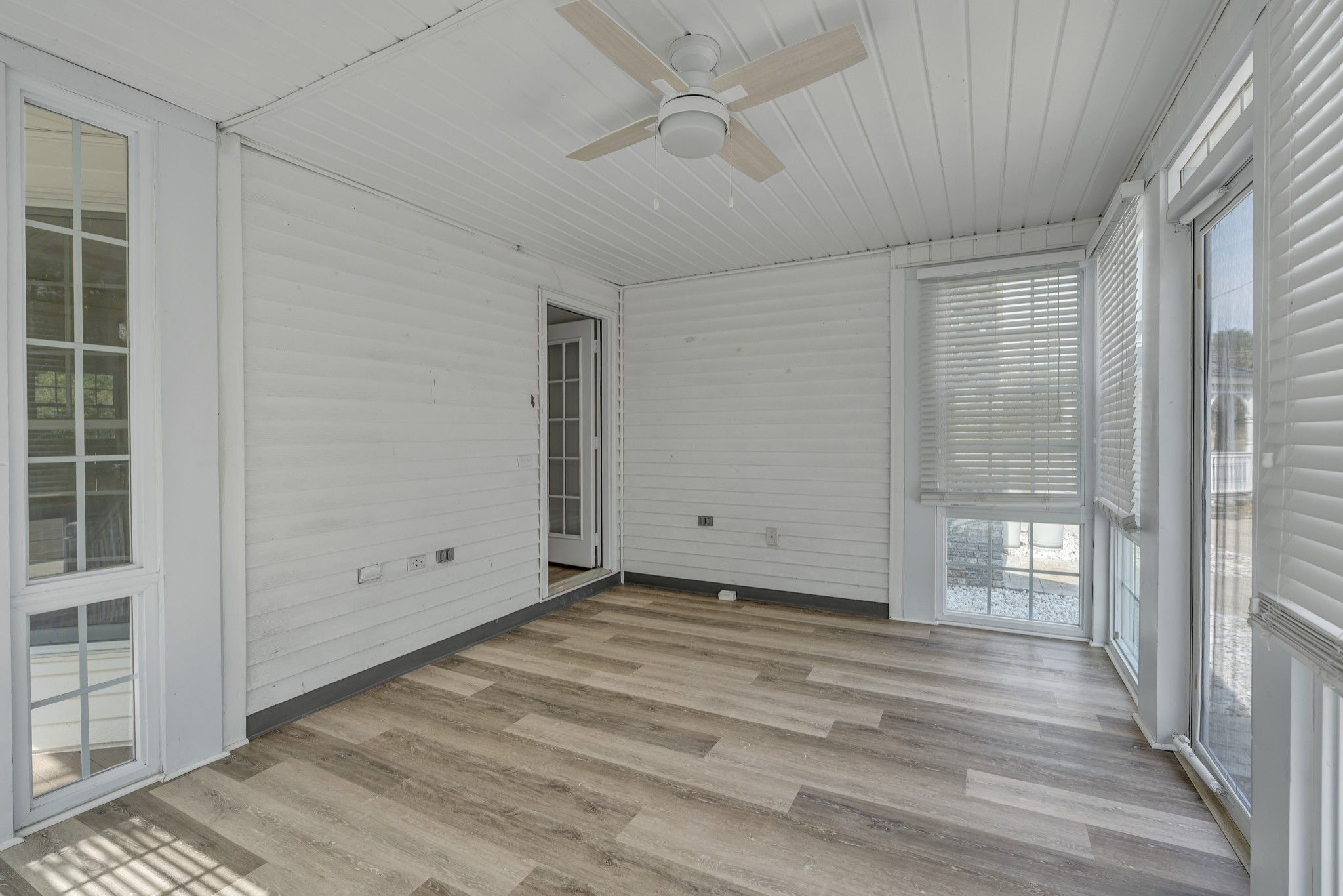 6041 Henry Gower Road Pleasant View, TN 37146 - Photo 40 of 63 a view of an empty room with wooden floor and a window