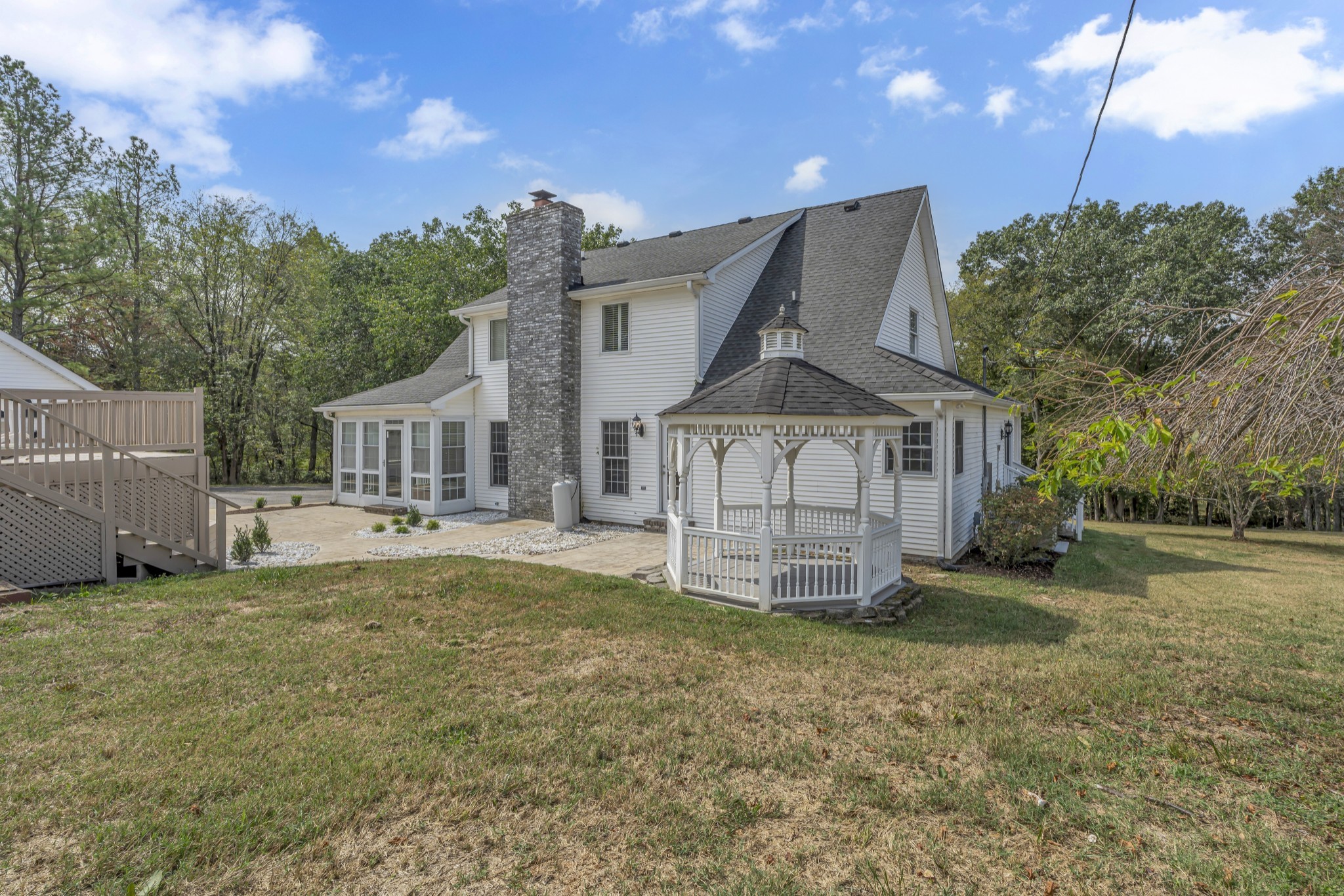 6041 Henry Gower Road Pleasant View, TN 37146 - Photo 47 of 63 a view of a house with a yard