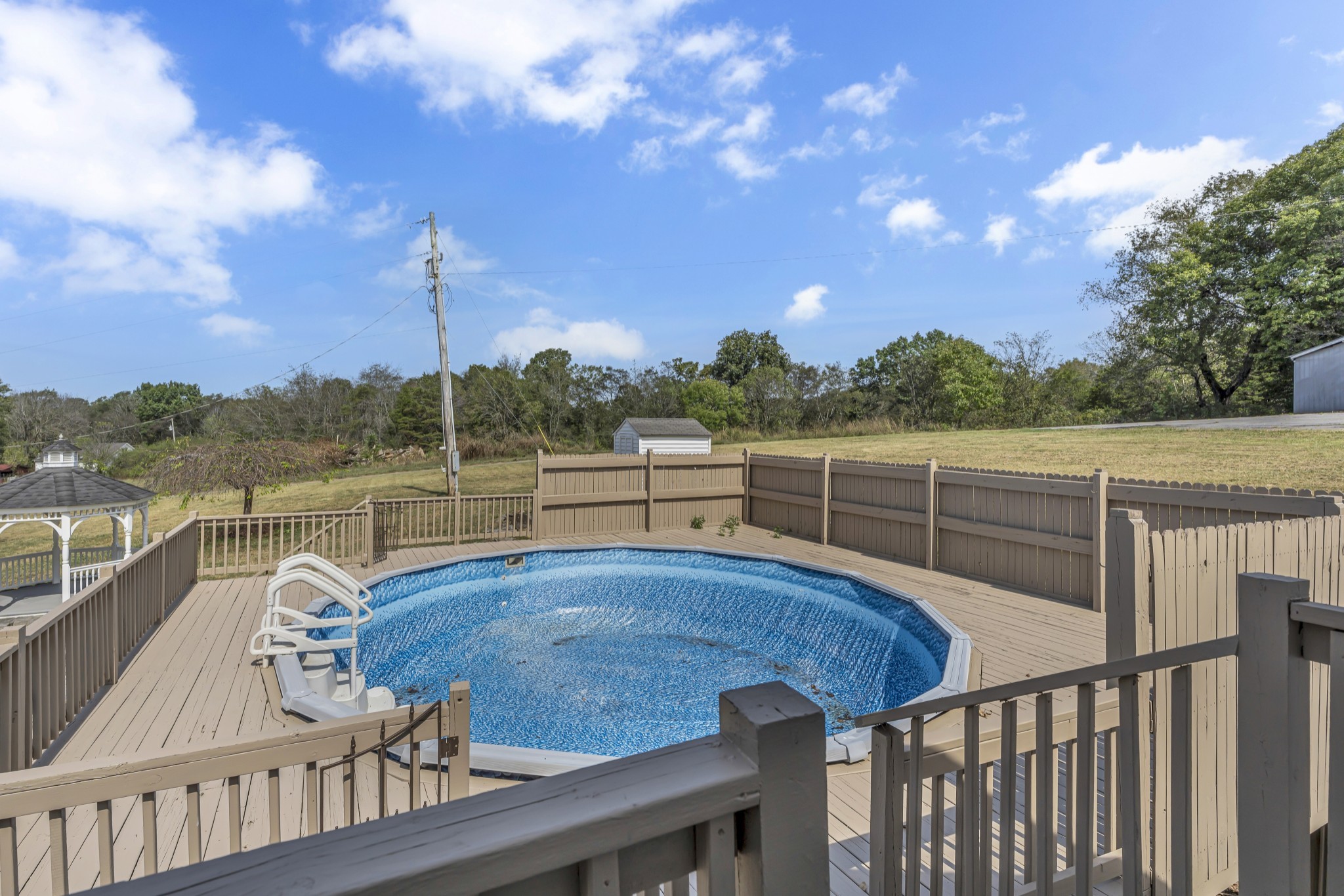 6041 Henry Gower Road Pleasant View, TN 37146 - Photo 51 of 63 a view of a balcony with lake view and wooden floor