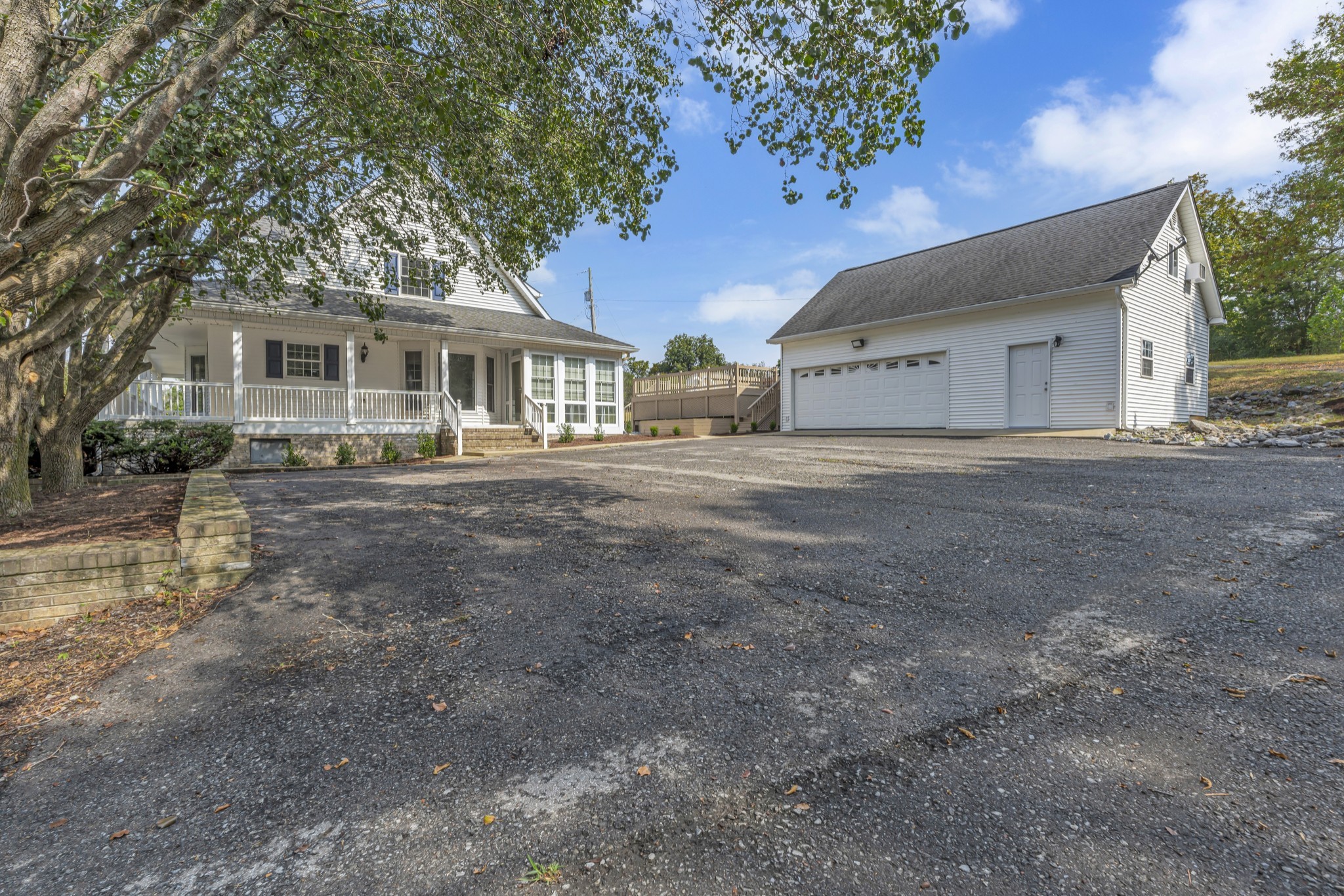 6041 Henry Gower Road Pleasant View, TN 37146 - Photo 8 of 63 a front view of a house with a yard and garage