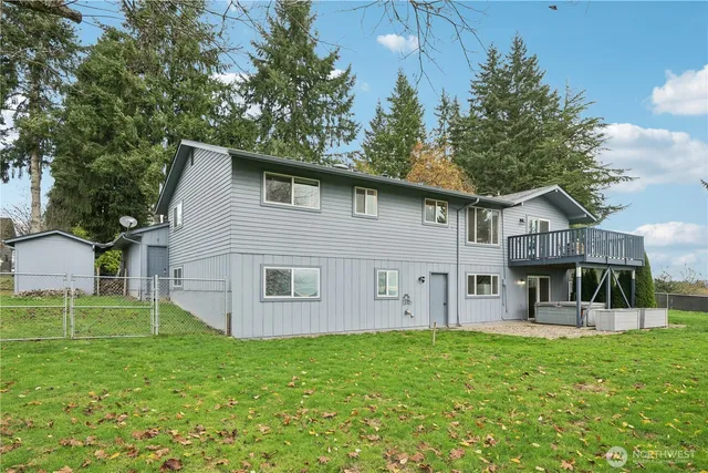 a view of backyard with barbeque grill potted plants and outdoor space