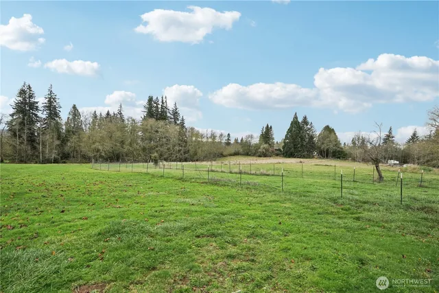 an aerial view of a residential houses with outdoor space