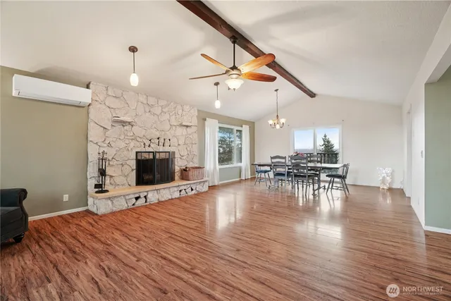 a view of a livingroom with furniture and a fireplace