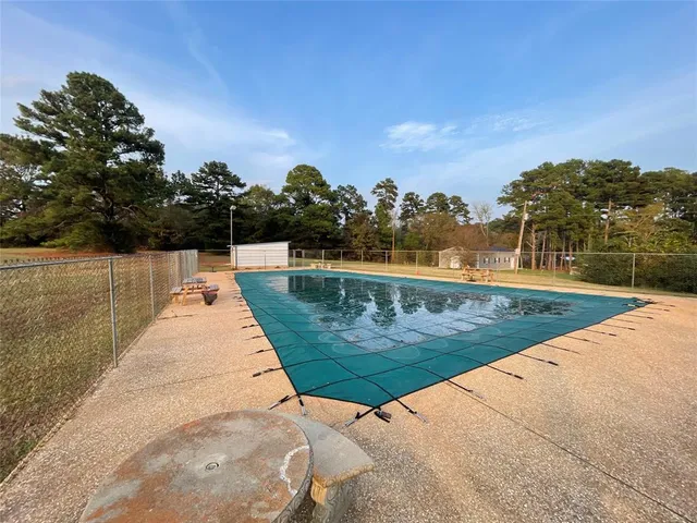 a view of swimming pool with a yard