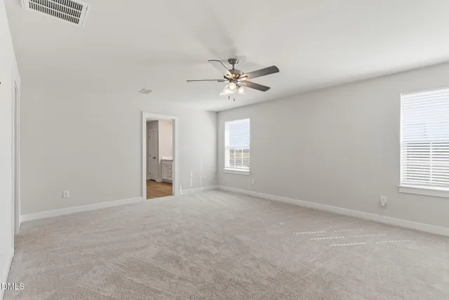 a bathroom with a double vanity sink toilet and shower