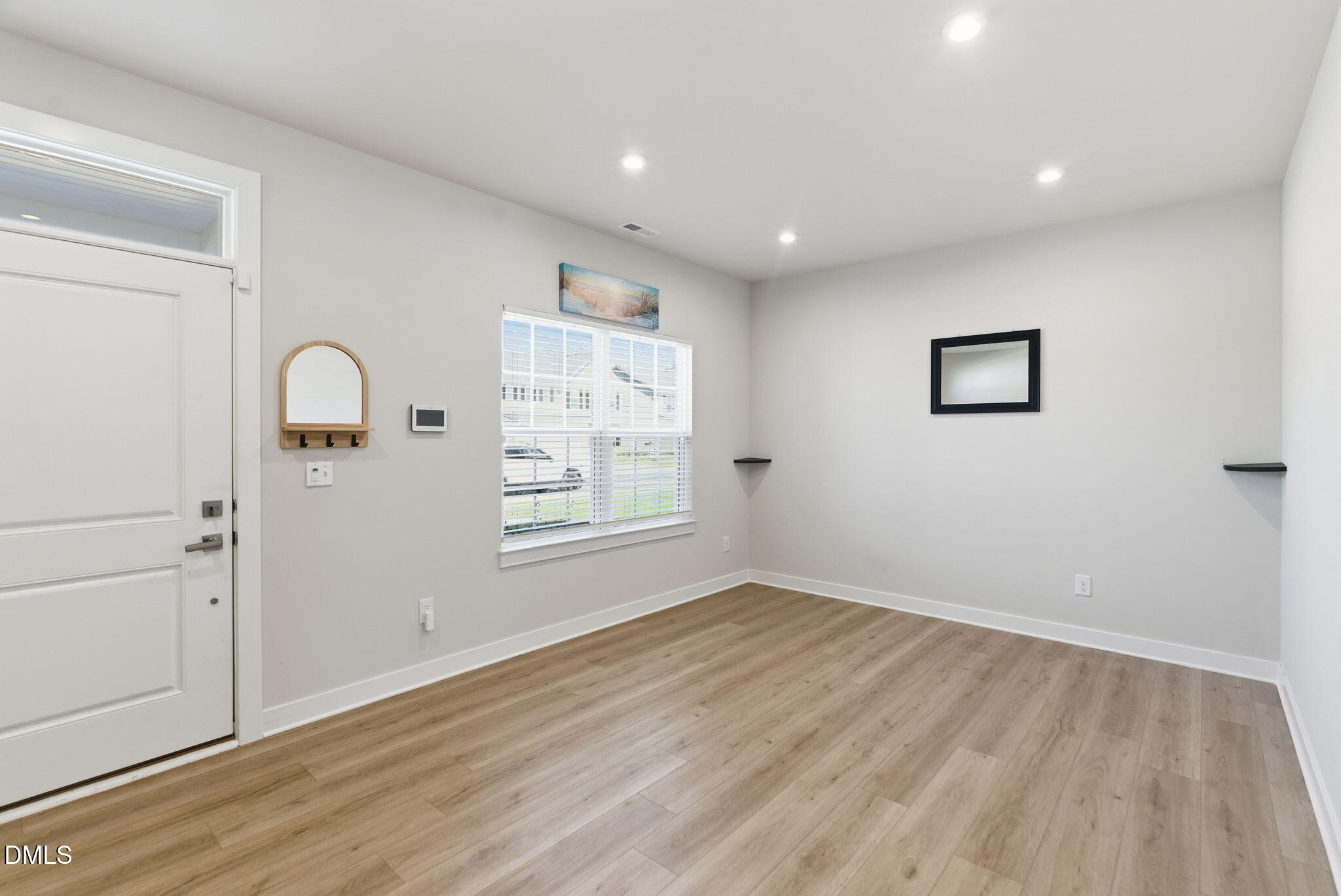 508 Freedom Trail Drive Willow Spring, NC 27592 - Photo 9 of 65 an empty room with wooden floor and window