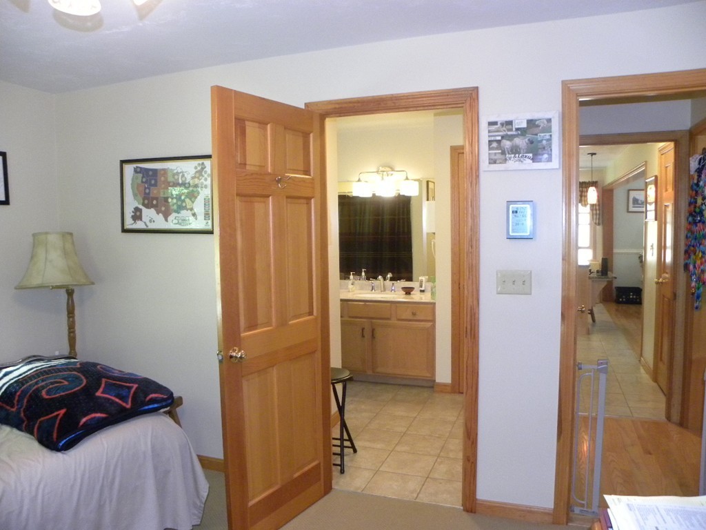290 North Sturbridge Road Charlton, MA 01507 - Photo 23 of 30 a bedroom with a bed and a view of bathroom