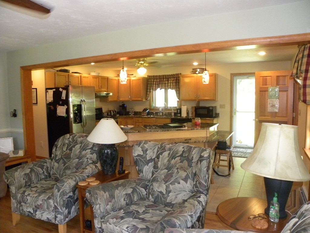 290 North Sturbridge Road Charlton, MA 01507 - Photo 28 of 30 a living room with furniture a lamp and a large window