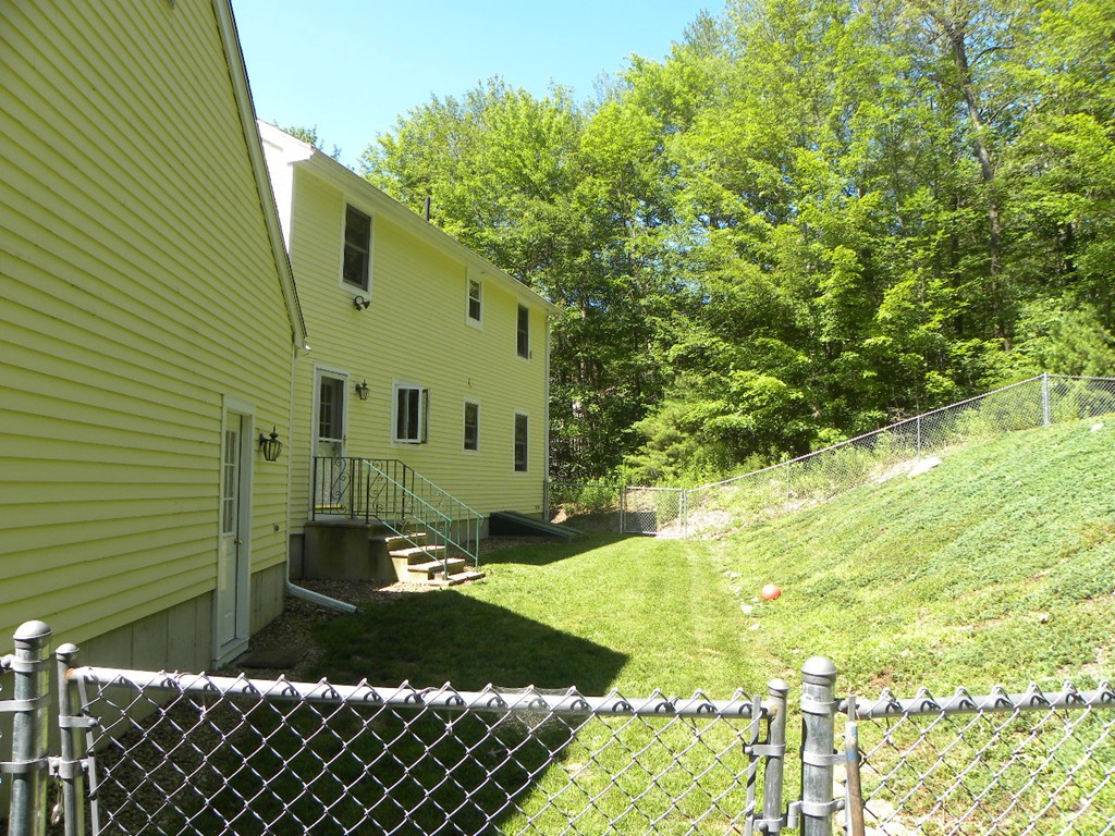 290 North Sturbridge Road Charlton, MA 01507 - Photo 30 of 30 a front view of a house with a yard