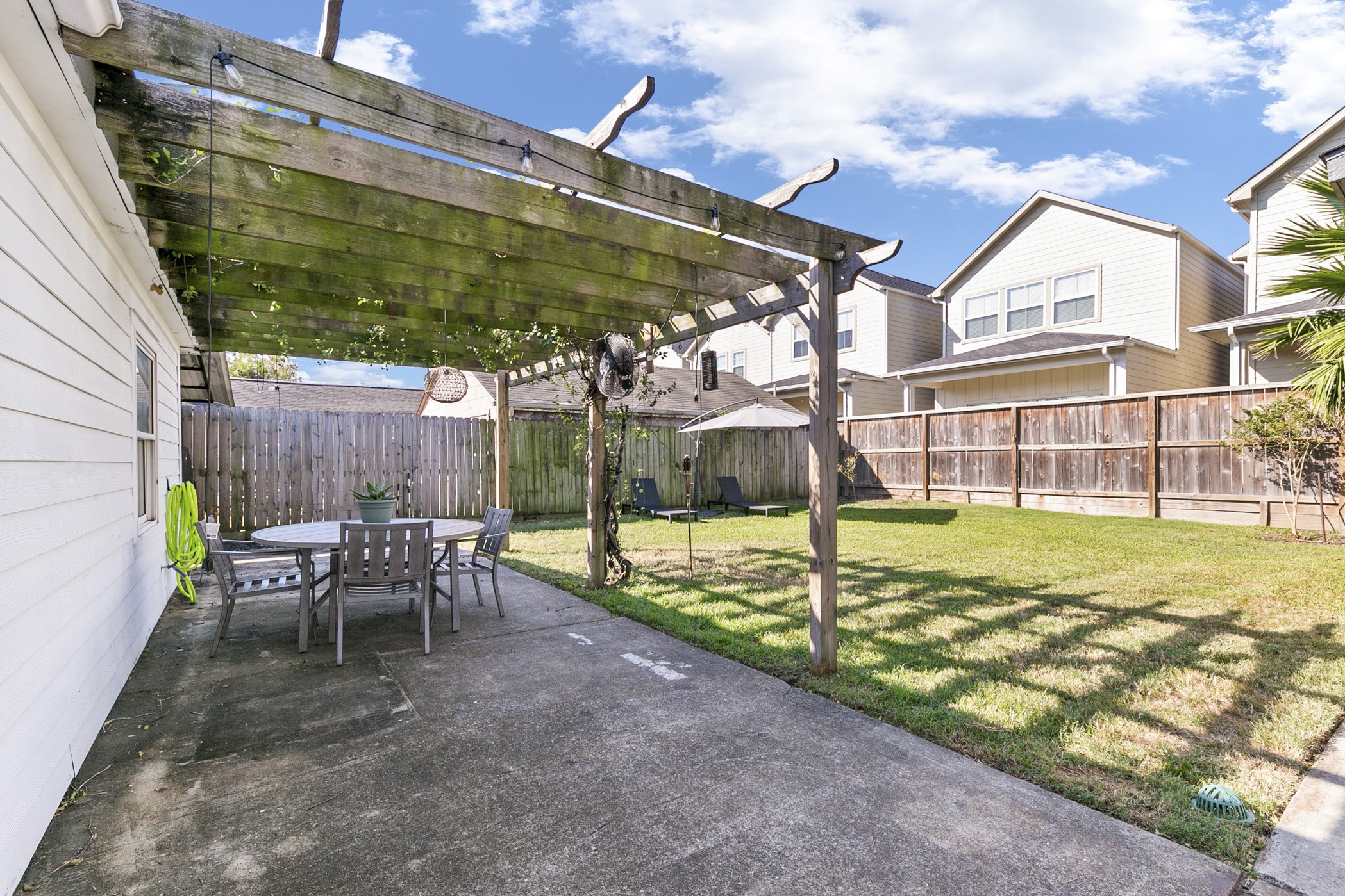 1609 Tabor Street Houston, TX 77009 - Photo 34 of 36 Enjoy outdoor living in the backyard, complete with a charming pergola that provides the perfect spot for relaxing or entertaining.