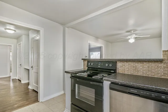 a kitchen with a stove and a microwave