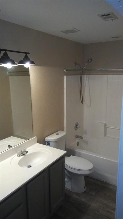306 Packer Drive Fate, TX 75189 - Photo 14 of 15 a bathroom with a sink a toilet and shower