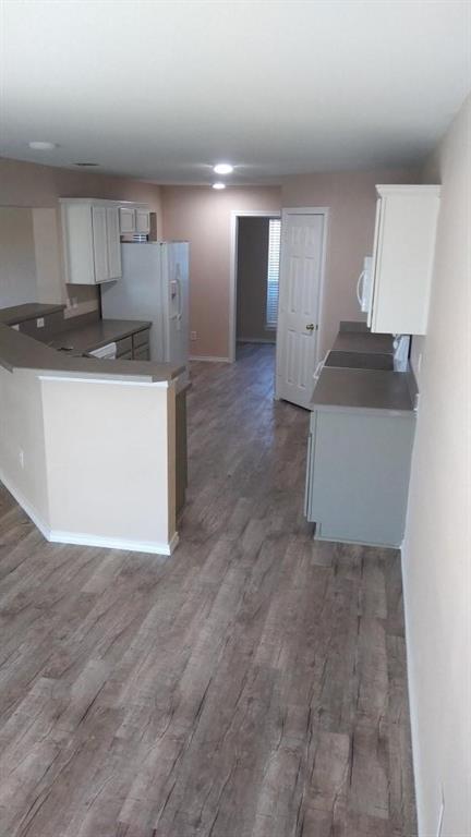 306 Packer Drive Fate, TX 75189 - Photo 6 of 15 a kitchen with stainless steel appliances granite countertop a refrigerator and a stove