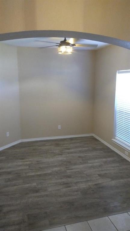 306 Packer Drive Fate, TX 75189 - Photo 8 of 15 a view of a room with wooden floor and fan