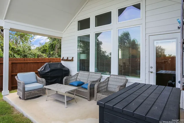 a outdoor space with patio the couches and a dining table with garden view