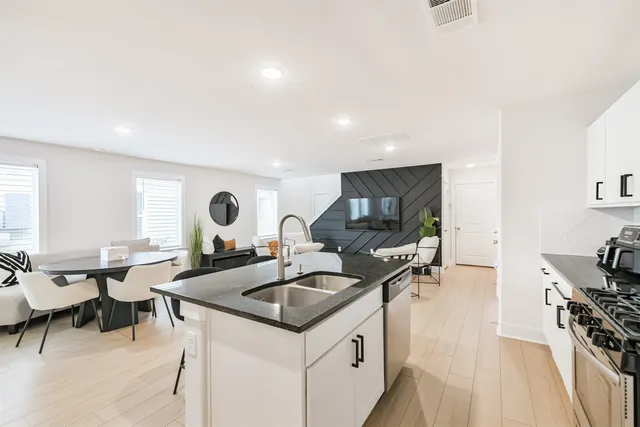 a kitchen with lots of counter top space and living room