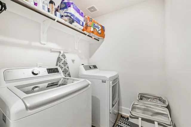 a utility room with dryer and washer